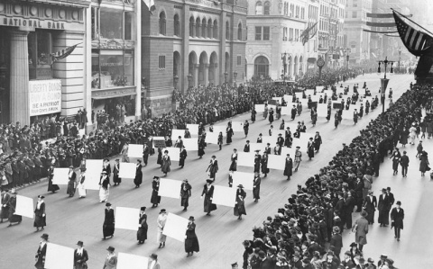 Womens_suffragists_parade_in_New_York_City_in_1917_carrying_placards_with_signatures_of_more_than_a_million_women