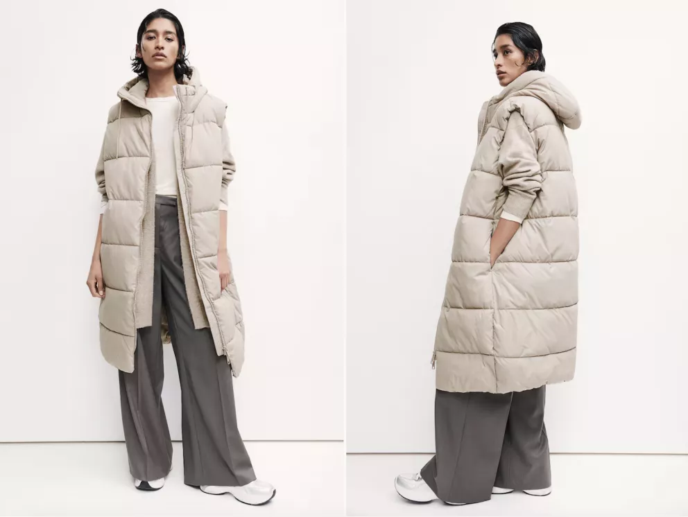 žena v dlouhé zimní vestě