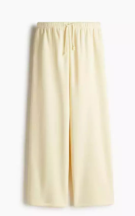 Široké kalhoty ve vanilkovém odstínu, H&M, 429 Kč