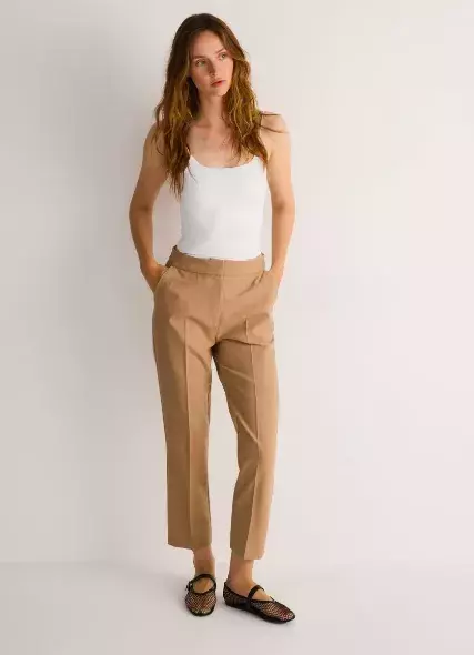 Cigaretové kalhoty z 80. let jsou zpět - tady je návod, jak je nosit po 50, abyste v nich omládla a ukázala postavu